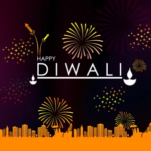 Happy Diwali in white type with diyas and golden fireworks over a city skyline at night